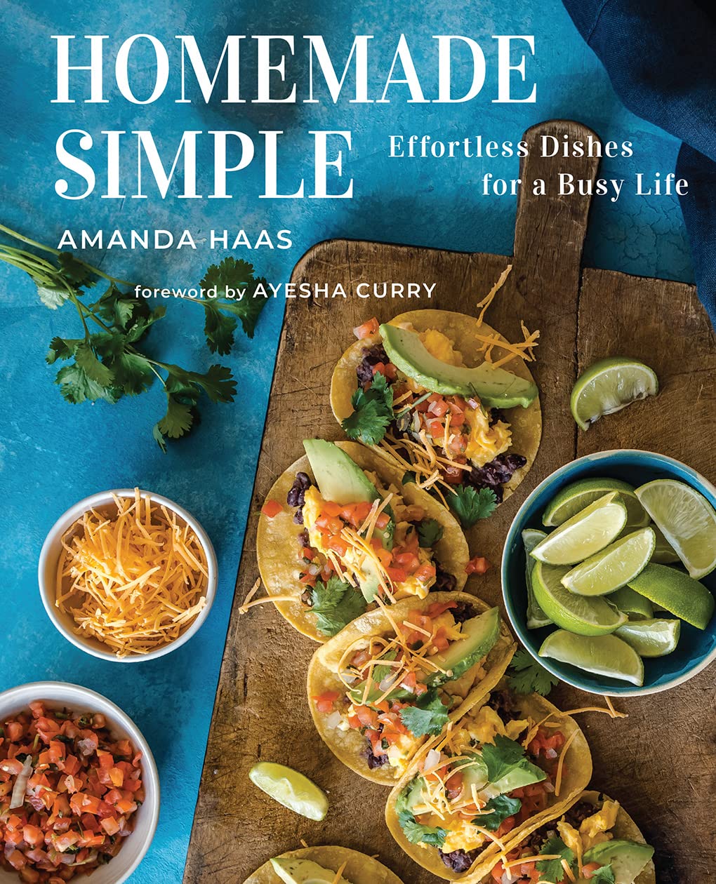 Homemade Simple cookbook cover with breakfast tacos on a wooden board and blue table